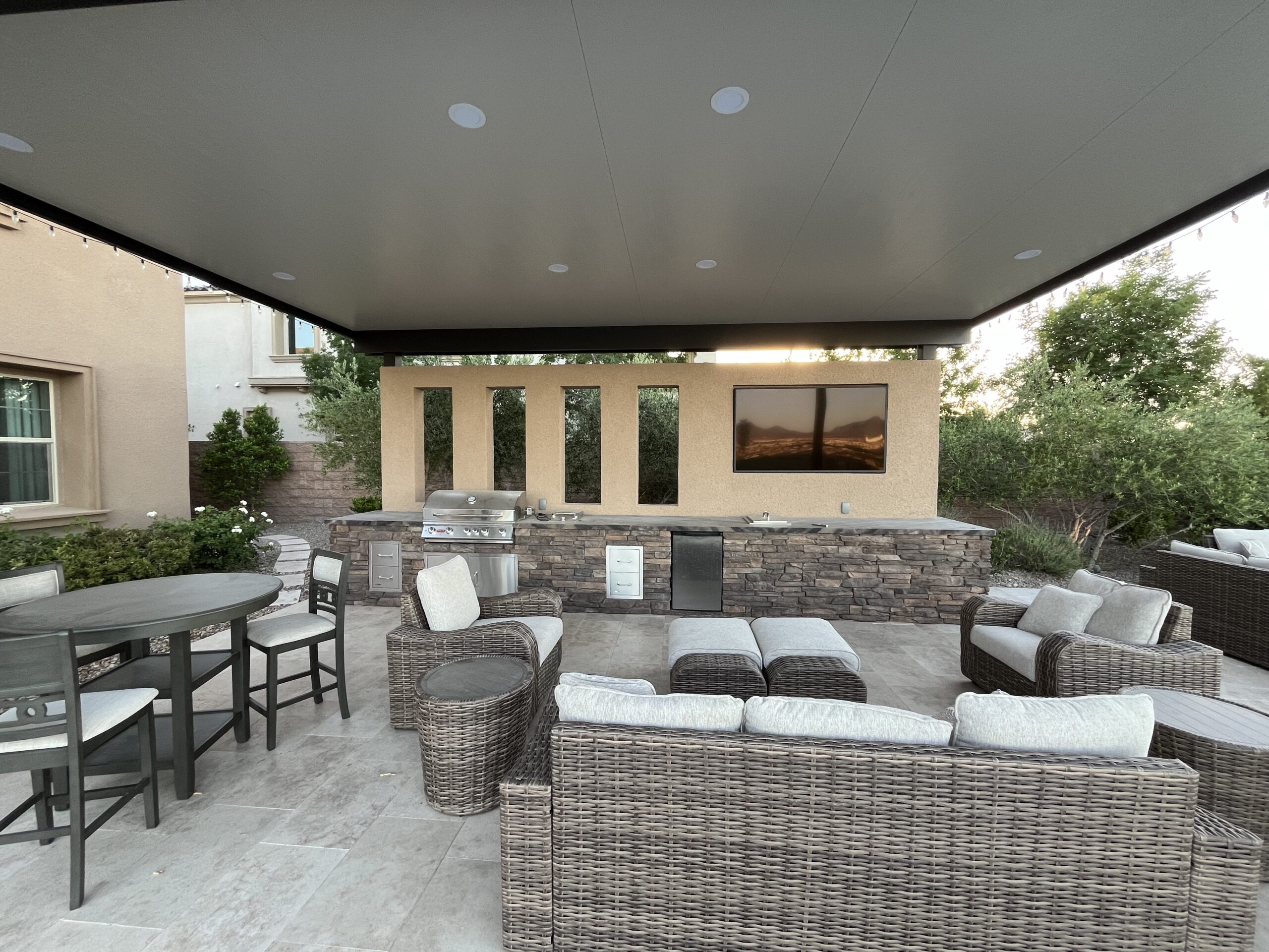 A patio with furniture and a television. A patio with furniture and a television.